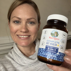 Jodi B. holding product