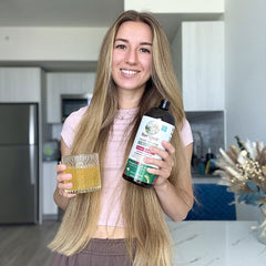 Maria G. holding product