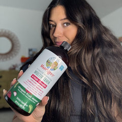 Kim C. holding product