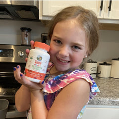 Danielle B. holding product