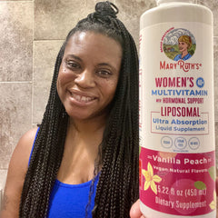 Maggie J. holding product