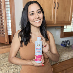Laura K. holding product
