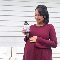 Claire M. holding product