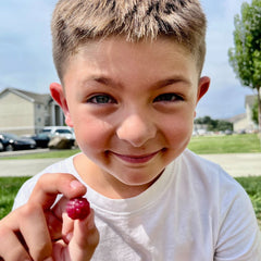 Alyssa C. holding product