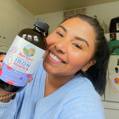 Monica M. holding product